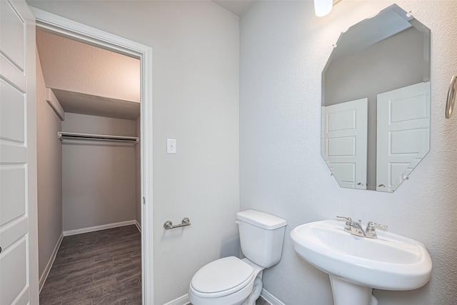 24711 Sonora Crescent Cir, Huffman, TX 77336 - bathroom featuring wood finished floors and toilet