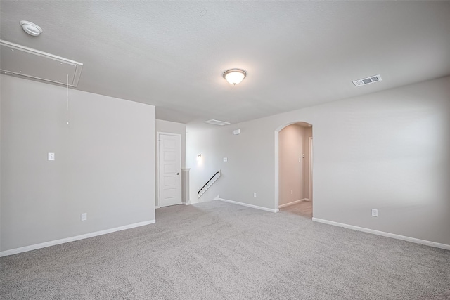 24711 Sonora Crescent Cir, Huffman, TX 77336 - empty room featuring attic access, arched walkways, carpet, and a smoke detector