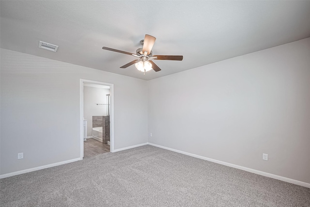 24711 Sonora Crescent Cir, Huffman, TX 77336 - spare room with a ceiling fan and carpet floors