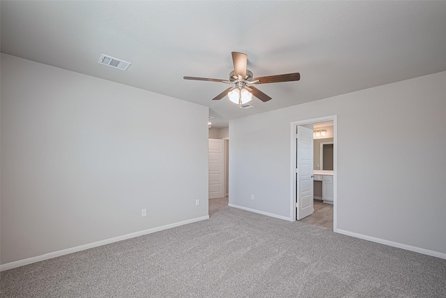 24711 Sonora Crescent Cir, Huffman, TX 77336 - unfurnished bedroom featuring light carpet, ensuite bathroom, and ceiling fan