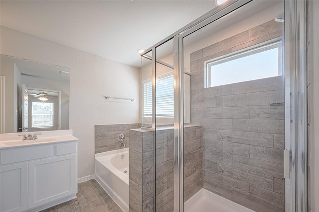 24711 Sonora Crescent Cir, Huffman, TX 77336 - full bath with a bath, a stall shower, vanity, and plenty of natural light