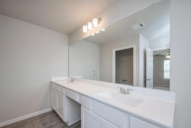 24711 Sonora Crescent Cir, Huffman, TX 77336 - bathroom featuring double vanity and wood finished floors