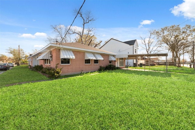 800 E Adoue St, Baytown, TX 77520 - view of home's exterior with a detached carport, brick siding, and a shingled roof