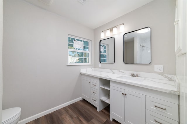 800 E Adoue St, Baytown, TX 77520 - bathroom with wood finished floors, double vanity, and a shower