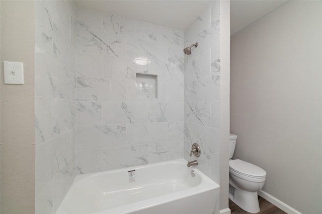 800 E Adoue St, Baytown, TX 77520 - bathroom featuring shower / bath combination and wood finished floors