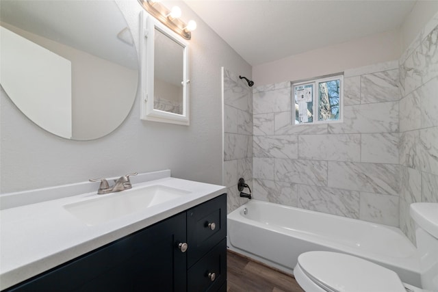 800 E Adoue St, Baytown, TX 77520 - full bath featuring vanity, shower / bathtub combination, and wood finished floors
