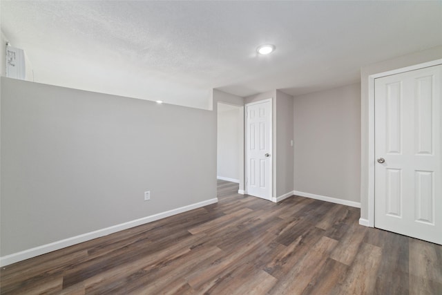 800 E Adoue St, Baytown, TX 77520 - below grade area with baseboards and dark wood-style flooring
