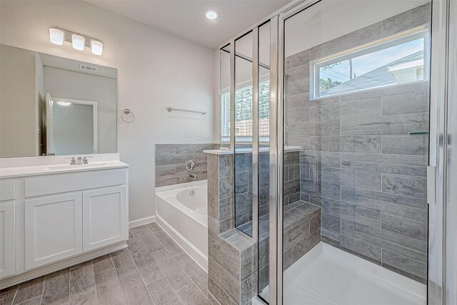 234 Emerald Thicket Ln, Huffman, TX 77336 - bathroom with a garden tub, a stall shower, and vanity