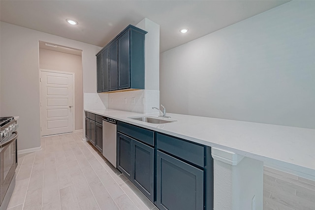 218 Emerald Thicket Ln, Huffman, TX 77336 - kitchen with appliances with stainless steel finishes, light countertops, backsplash, and recessed lighting