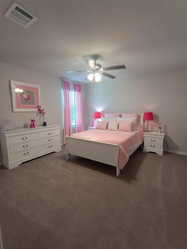 12303 Sterling Oak Dr, Humble, TX 77044 - carpeted bedroom with a ceiling fan and baseboards