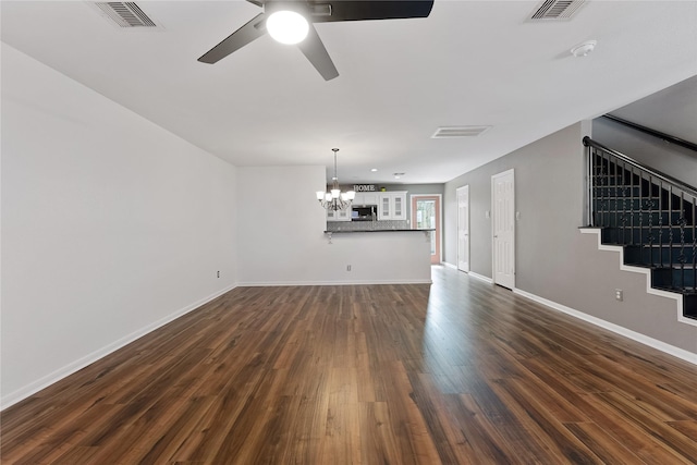 2623 Woodridge Cove Dr, Houston, TX 77087 - unfurnished living room with a chandelier, a ceiling fan, stairway, and dark wood finished floors
