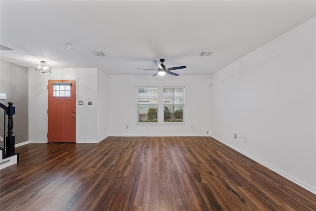 2623 Woodridge Cove Dr, Houston, TX 77087 - unfurnished living room with dark wood finished floors, a ceiling fan, a chandelier, and stairs
