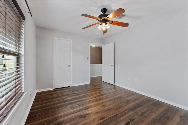 2623 Woodridge Cove Dr, Houston, TX 77087 - unfurnished bedroom with dark wood finished floors and ceiling fan