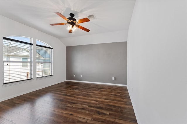 2623 Woodridge Cove Dr, Houston, TX 77087 - spare room with dark wood-style flooring, a ceiling fan, and vaulted ceiling
