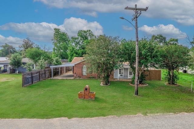 810 Roosevelt St, Sealy, TX 77474 - view of yard with a carport