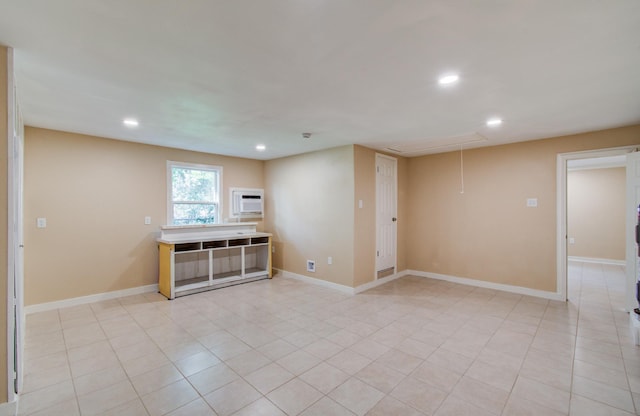810 Roosevelt St, Sealy, TX 77474 - empty room featuring recessed lighting, light tile patterned floors, and attic access