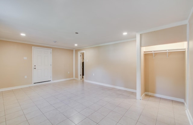810 Roosevelt St, Sealy, TX 77474 - unfurnished bedroom with recessed lighting, crown molding, a closet, and light tile patterned floors