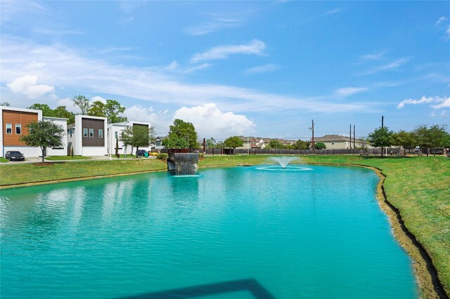 5509 Paraiso Pl, Houston, TX 77091 - view of swimming pool with a yard and a water view