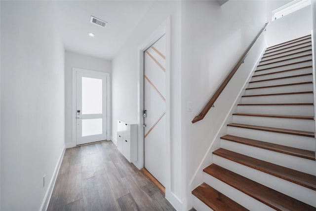 5509 Paraiso Pl, Houston, TX 77091 - stairs featuring wood finished floors, healthy amount of natural light, and recessed lighting