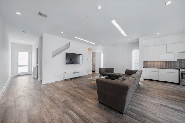 5509 Paraiso Pl, Houston, TX 77091 - living area with dark wood-style floors and recessed lighting