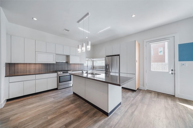 5509 Paraiso Pl, Houston, TX 77091 - kitchen with stainless steel appliances, dark countertops, healthy amount of natural light, and recessed lighting