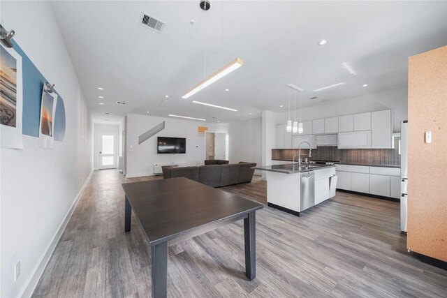 5509 Paraiso Pl, Houston, TX 77091 - dining space with wood finished floors and recessed lighting