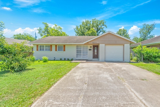 4517 W 43rd St, Houston, TX 77092 - ranch-style house with brick siding, a garage, a front lawn, and concrete driveway