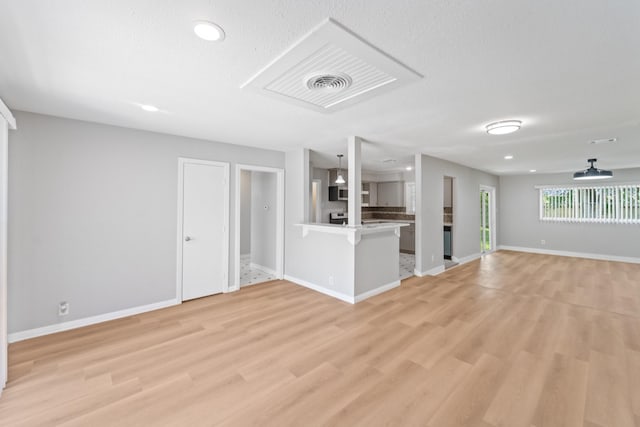4517 W 43rd St, Houston, TX 77092 - unfurnished living room featuring light wood-type flooring and recessed lighting