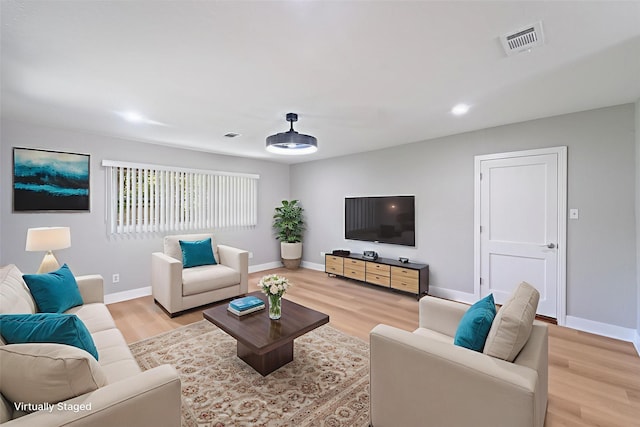 4517 W 43rd St, Houston, TX 77092 - living room with light wood finished floors and baseboards