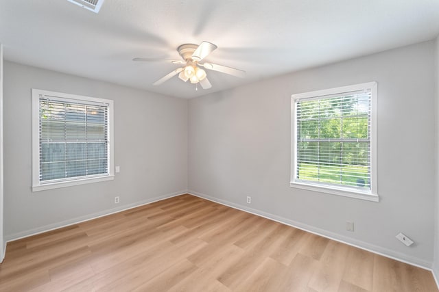 4517 W 43rd St, Houston, TX 77092 - empty room with light wood-style floors and ceiling fan