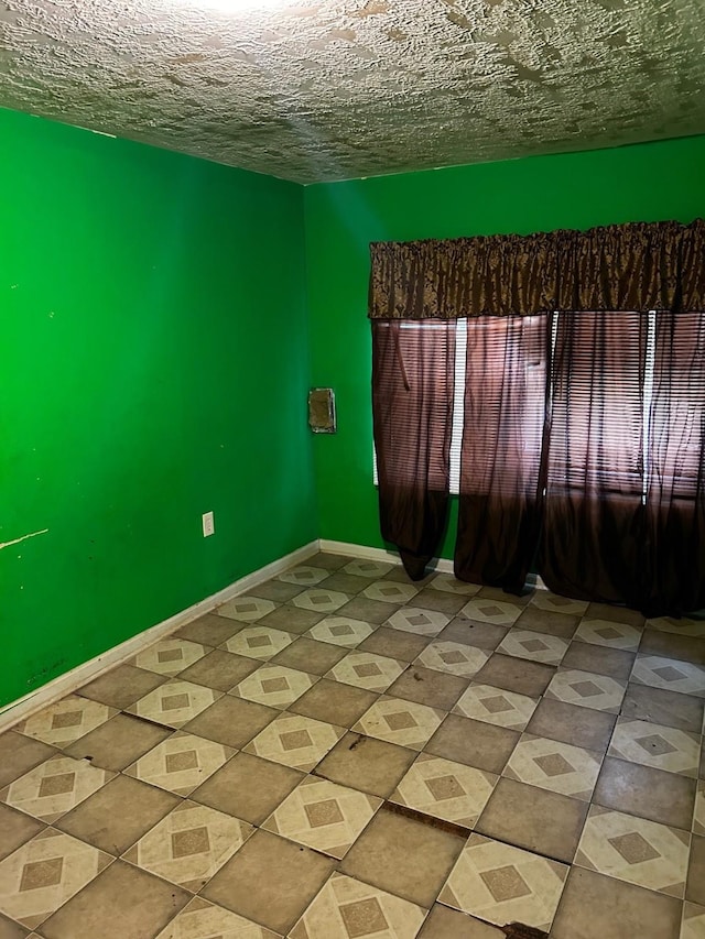 7214 Schuller Rds, Houston, TX 77093 - unfurnished room featuring tile patterned floors and a textured ceiling