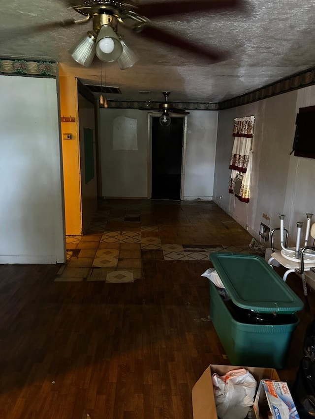 7214 Schuller Rds, Houston, TX 77093 - living room with a ceiling fan, wood finished floors, and a textured ceiling