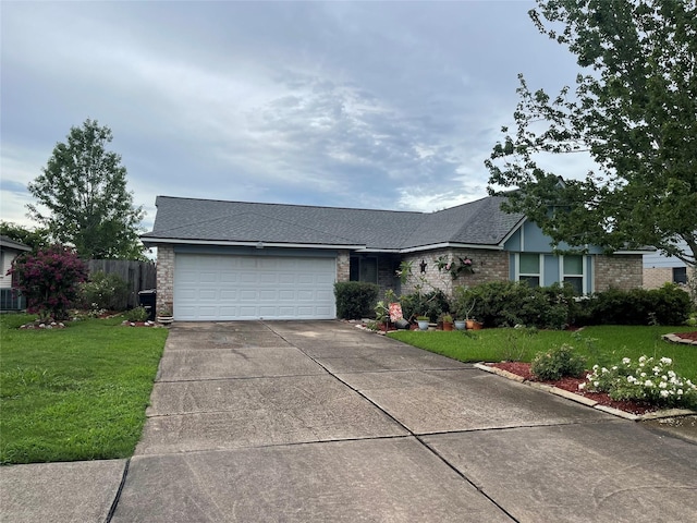 813 Camelot Ln, Friendswood, TX 77546 - view of front of house featuring concrete driveway, an attached garage, brick siding, and roof with shingles