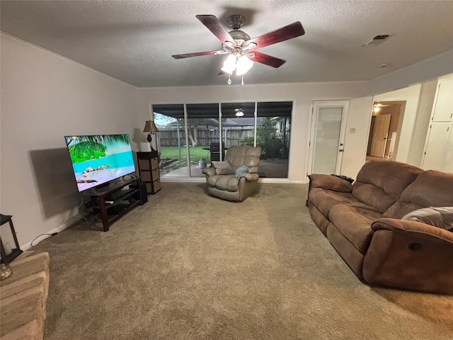 813 Camelot Ln, Friendswood, TX 77546 - carpeted living area with ceiling fan and a textured ceiling
