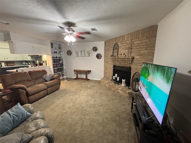 813 Camelot Ln, Friendswood, TX 77546 - carpeted living room featuring a textured ceiling, a ceiling fan, and a brick fireplace