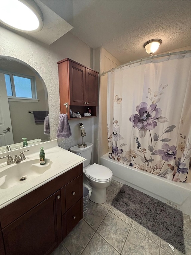 813 Camelot Ln, Friendswood, TX 77546 - full bathroom featuring vanity, shower / tub combo with curtain, a textured ceiling, and tile patterned floors