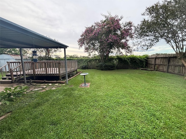 813 Camelot Ln, Friendswood, TX 77546 - fenced backyard with a wooden deck and a storage shed