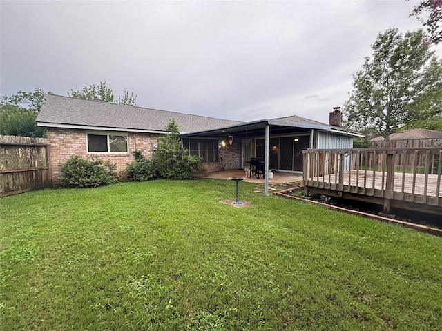 813 Camelot Ln, Friendswood, TX 77546 - rear view of house featuring brick siding, a deck, a shingled roof, and a patio area