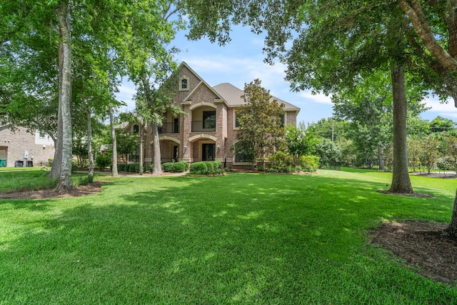 52 Tall Trl, Missouri City, TX 77459 - view of front facade featuring a front lawn and brick siding