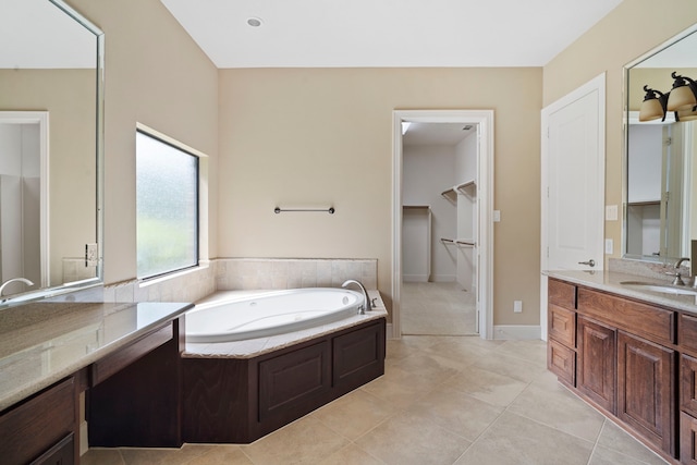 52 Tall Trl, Missouri City, TX 77459 - bathroom with a bath, vanity, tile patterned flooring, and a spacious closet