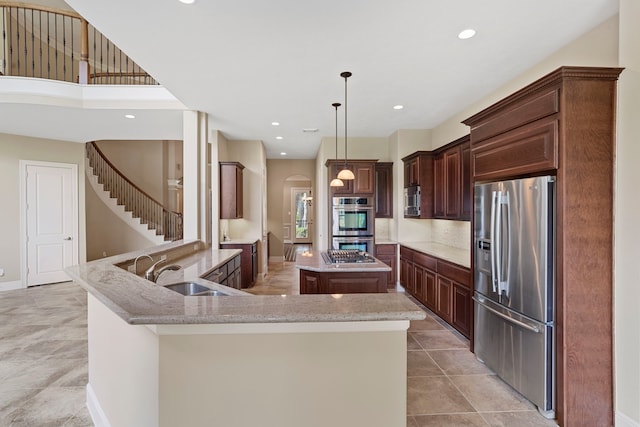 52 Tall Trl, Missouri City, TX 77459 - kitchen with stainless steel appliances, a kitchen island, arched walkways, light stone counters, and recessed lighting