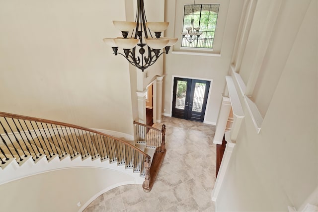 52 Tall Trl, Missouri City, TX 77459 - entryway with a chandelier, french doors, stairway, and a towering ceiling