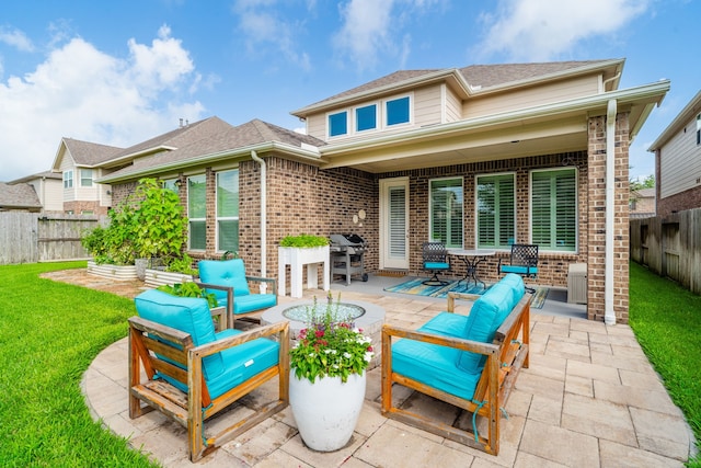 10118 Cypress Path, Missouri City, TX 77459 - fenced backyard with a patio area, an outdoor living space, and a grill