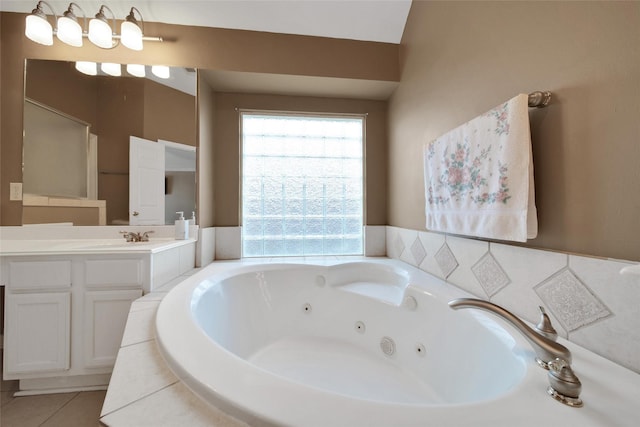 22710 Sierra Lake Ct, Katy, TX 77494 - full bath featuring vanity, a whirlpool tub, and tile patterned floors