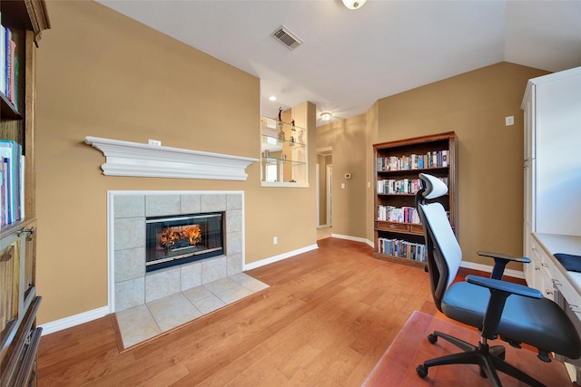 22710 Sierra Lake Ct, Katy, TX 77494 - office space featuring wood finished floors and a tile fireplace