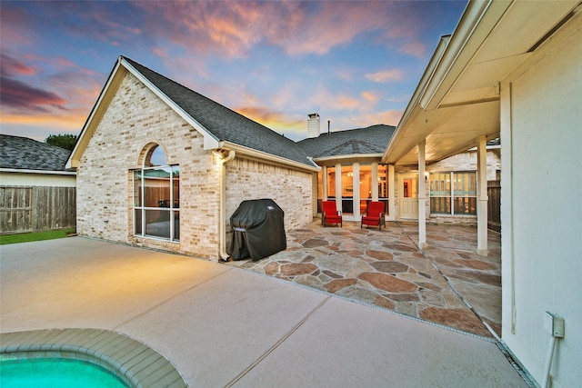 22710 Sierra Lake Ct, Katy, TX 77494 - patio terrace at dusk featuring area for grilling and a patio area