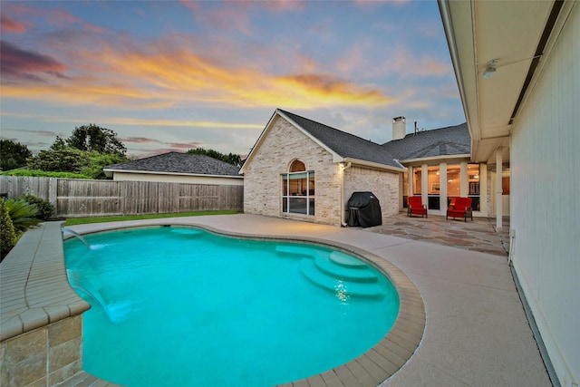 22710 Sierra Lake Ct, Katy, TX 77494 - view of swimming pool with a patio, grilling area, and a fenced backyard
