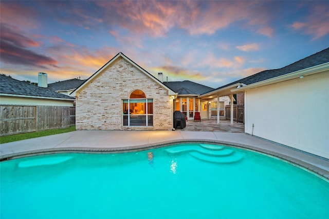 22710 Sierra Lake Ct, Katy, TX 77494 - pool at dusk with a patio