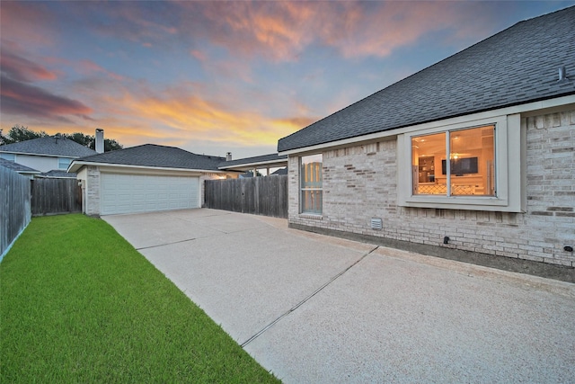 22710 Sierra Lake Ct, Katy, TX 77494 - view of home's exterior featuring concrete driveway, a shingled roof, and brick siding