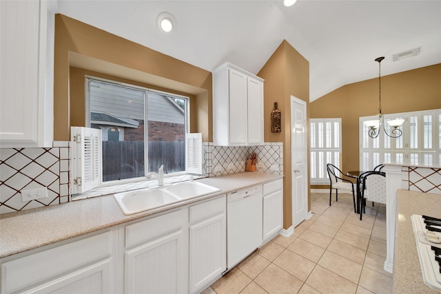 22710 Sierra Lake Ct, Katy, TX 77494 - kitchen with white dishwasher, lofted ceiling, a chandelier, white cabinets, and light tile patterned floors